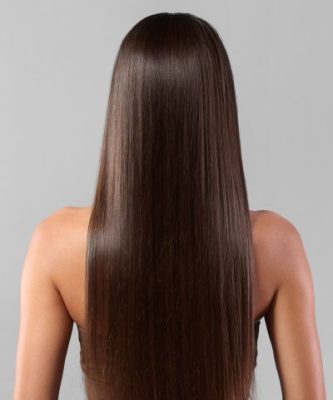 Woman shows off thick, beautiful hair after a TED Hair Restoration treatment