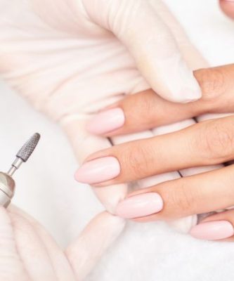 Woman receives a nail fungus treatment
